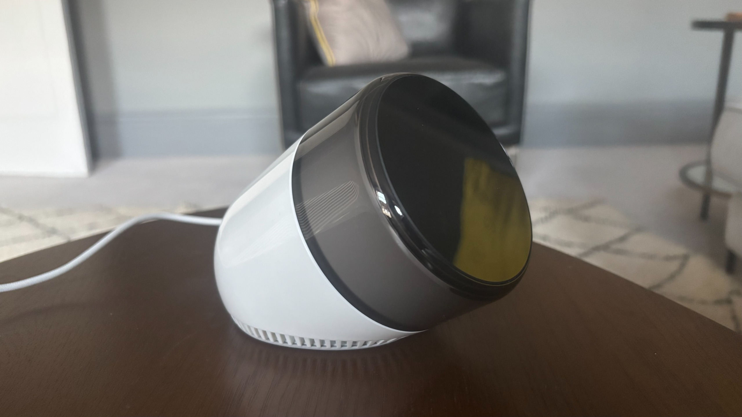 An Ambient Dreamie sunrise alarm on a coffee table.