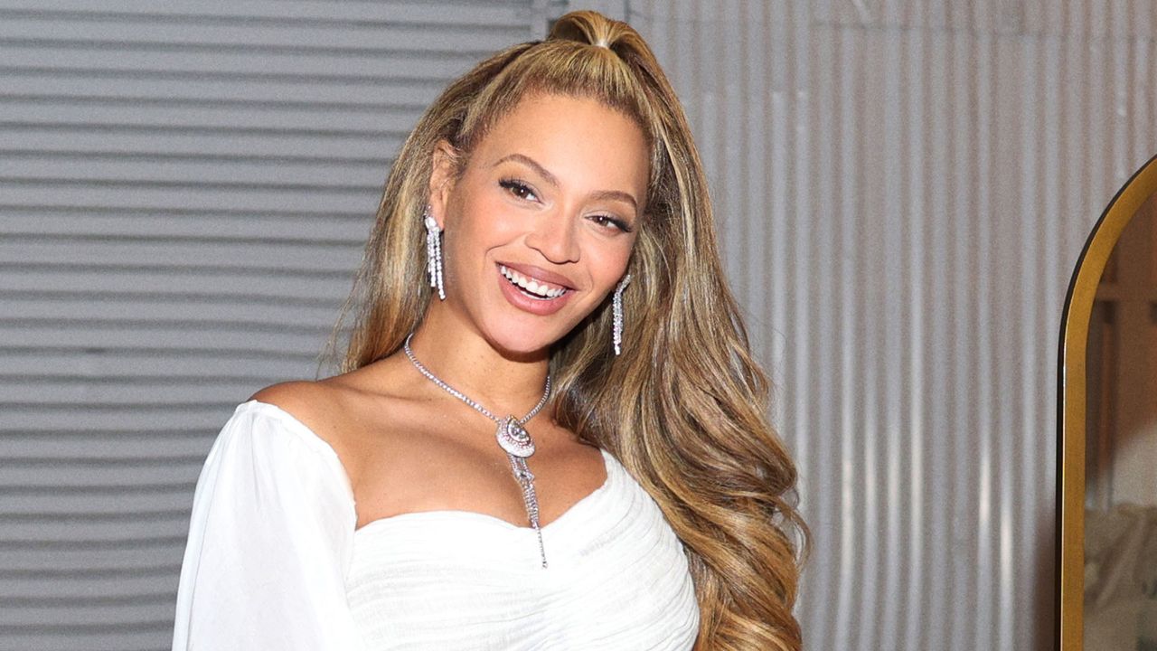 Beyoncé in a white outfit at the launch of her hair care line, CÉCRED