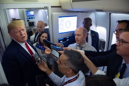 Trump meets the press aboard Air Force One