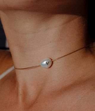 woman wearing pearl choker