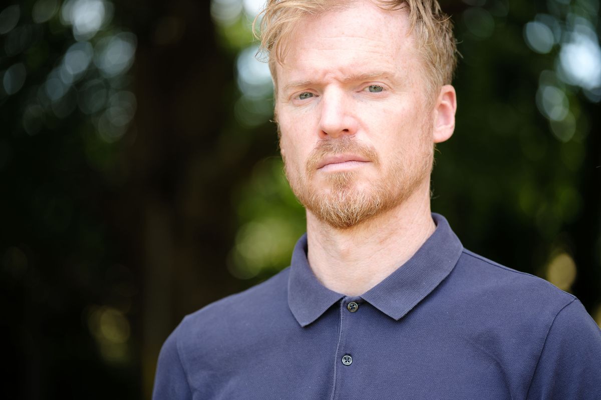 Viltrox AF 90mm F2.2 EVO and Fujifilm XF 90mm f/2 R LM WR lens comparisons: upper body portrait of a man with backlit trees