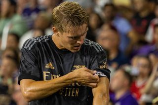 Arsenal captain Martin Odegaard adjusts his captains armband during a game between Arsenal FC and Orlando City at Exploria Stadium on July 20, 2022 in Orlando, Florida.