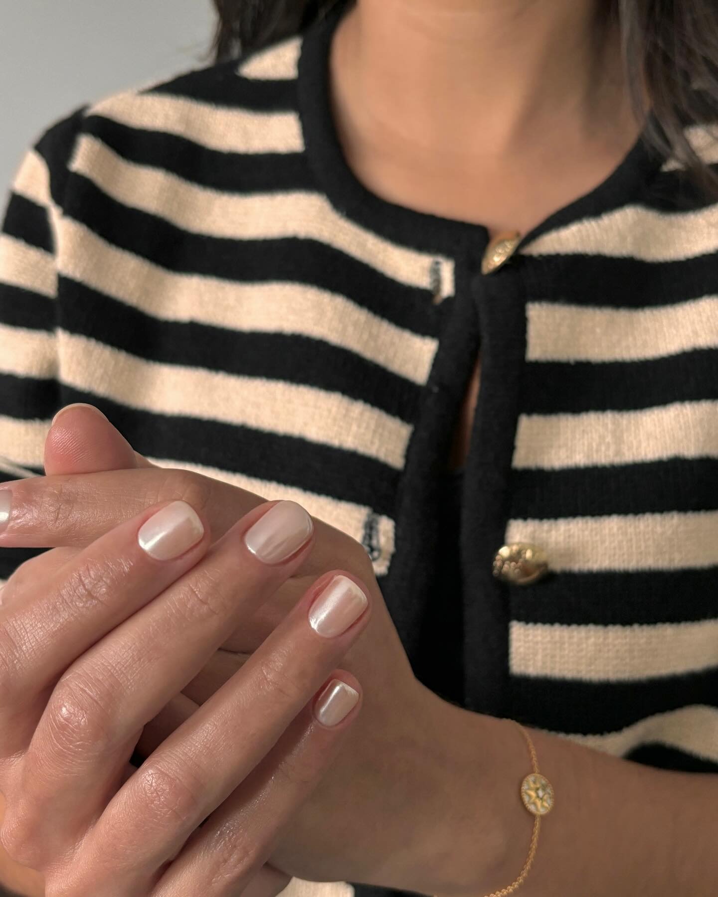 Smooth pearl neutral nail color.