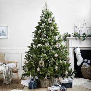 An artificial Christmas tree in a white living room