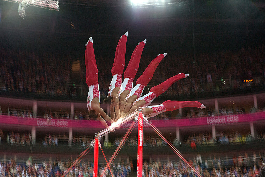Gymnastics: 2012 Summer Olympics: Multiple exposure view of Russia Emin Garibov in action, high bar during Men's Team All-Around Final at North Greenwich Arena. London, United Kingdom 7/30/2012