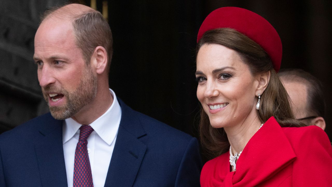 Kate Middleton wearing a red coat and hat and smiling at the camera on Commonwealth Day 2025