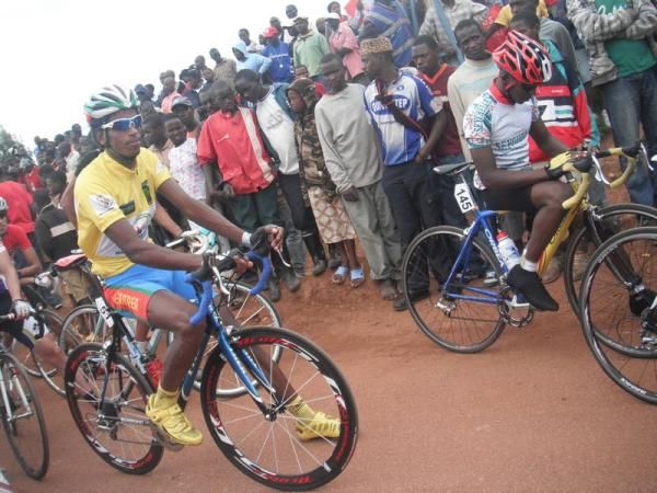 Race leader Daniel Teklehaimanot (Eritrea) and James Bristol (Seychelles) await the start of stage three.