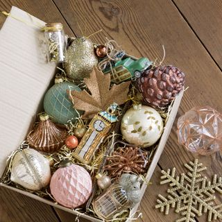 Metallic Christmas decorations and baubles in box
