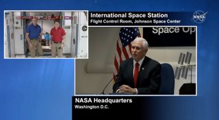 Vice President Mike Pence speaks with NASA astronaut Anne McClain and the Canadian Space Agency's David Saint-Jacques via video linkup on March 6, 2019.