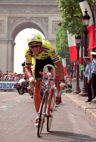 FILES FRANCE Greg LeMond of the US rides on the Champs Elysees in a 23 July 1989 during the last stage of the Tour de France which he won three times LeMond is expected to officially announce his retirement late 03 December 1994 in California LeMond said wounds from an accidental shooting in 1987 are forcing him to retire Photo credit should read FILESAFP via Getty Images
