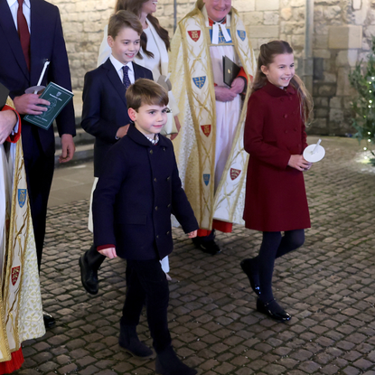 Catherine, Princess of Wales, Prince Louis of Wales, Princess Charlotte of Wales, Prince William, Prince of Wales and Prince George of Wales process out of The "Together At Christmas" Carol Service