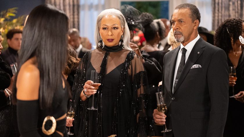 Tamara Tunie and Clifton Davis as Anita and Vernon Dupree at a wedding in Beyond the Gates