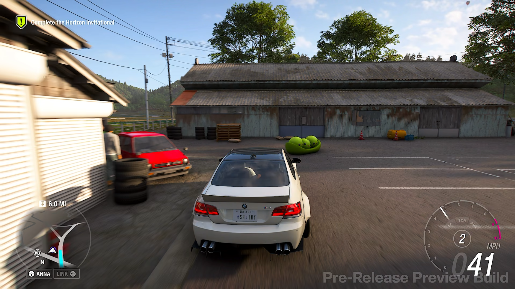 Approaching a Regional Mascot in the Forza Horizon 6 preview build in a BMW M3.