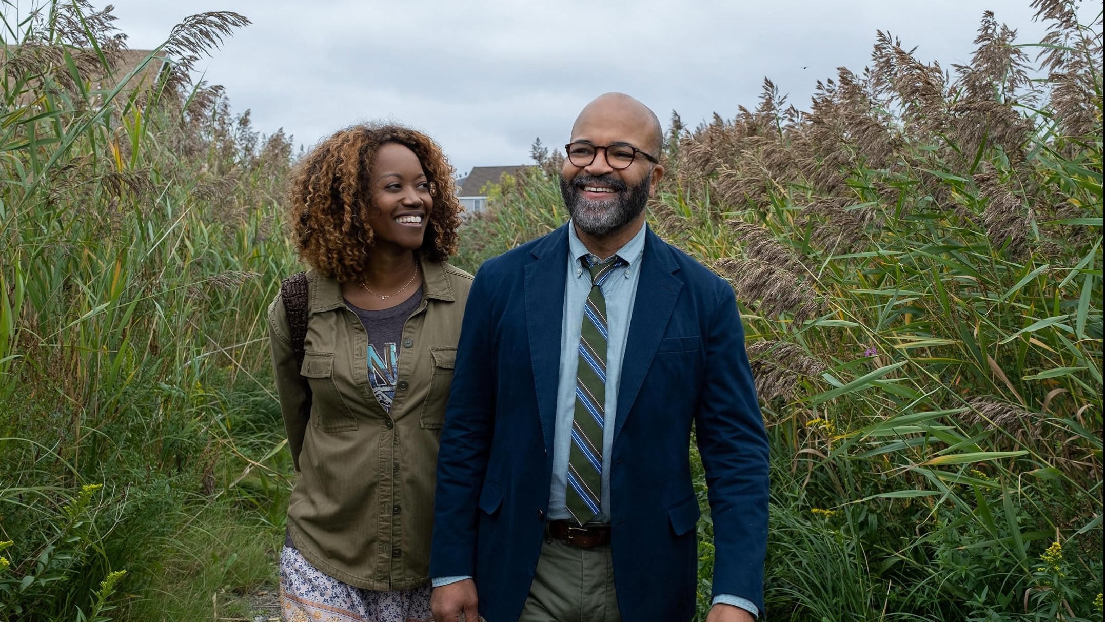 Erika Alexander and Jeffrey Wright walking together in American Fiction