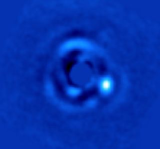 This image shows a brown dwarf (a failed star) called HIP 79124 B, orbiting its parent star at a distance 23 times further than Earth is from the sun. The brown dwarf was imaged with the vortex coronagraph instrument at the Keck Observatory in Hawaii.