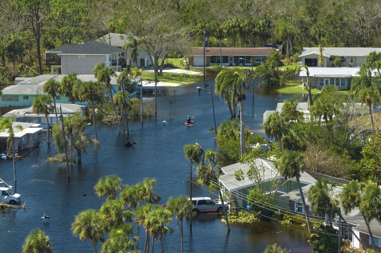 Surrounded by hurricane Ian rainfall flood waters homes in Florida residential area. Consequences of natural disaster