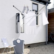 The Brabantia Wallfix Dryer fixed to a wall painted white