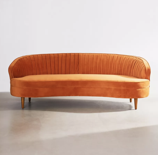 orange couch with curved edges