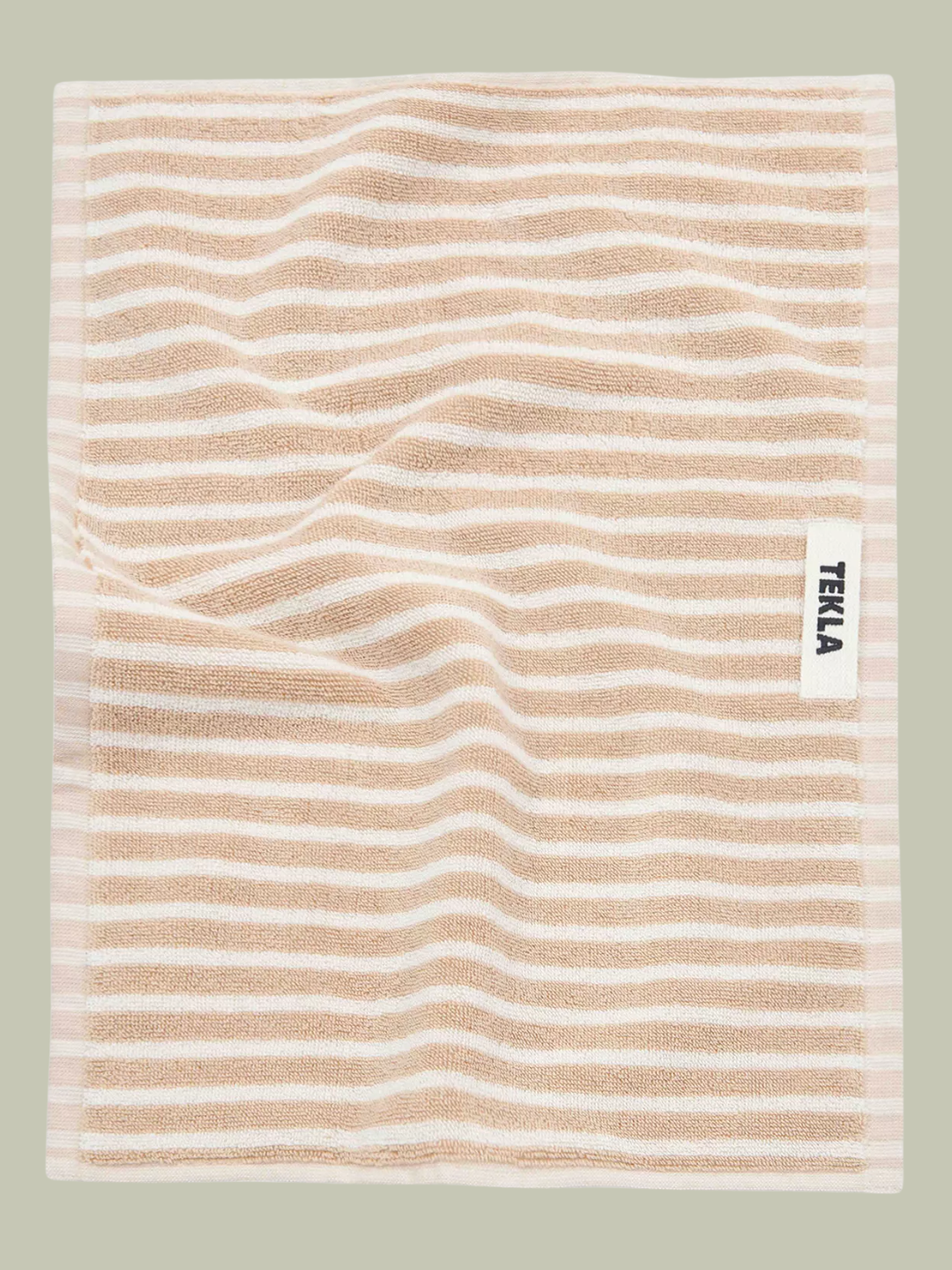 A striped cream and beige towel from TEKLA