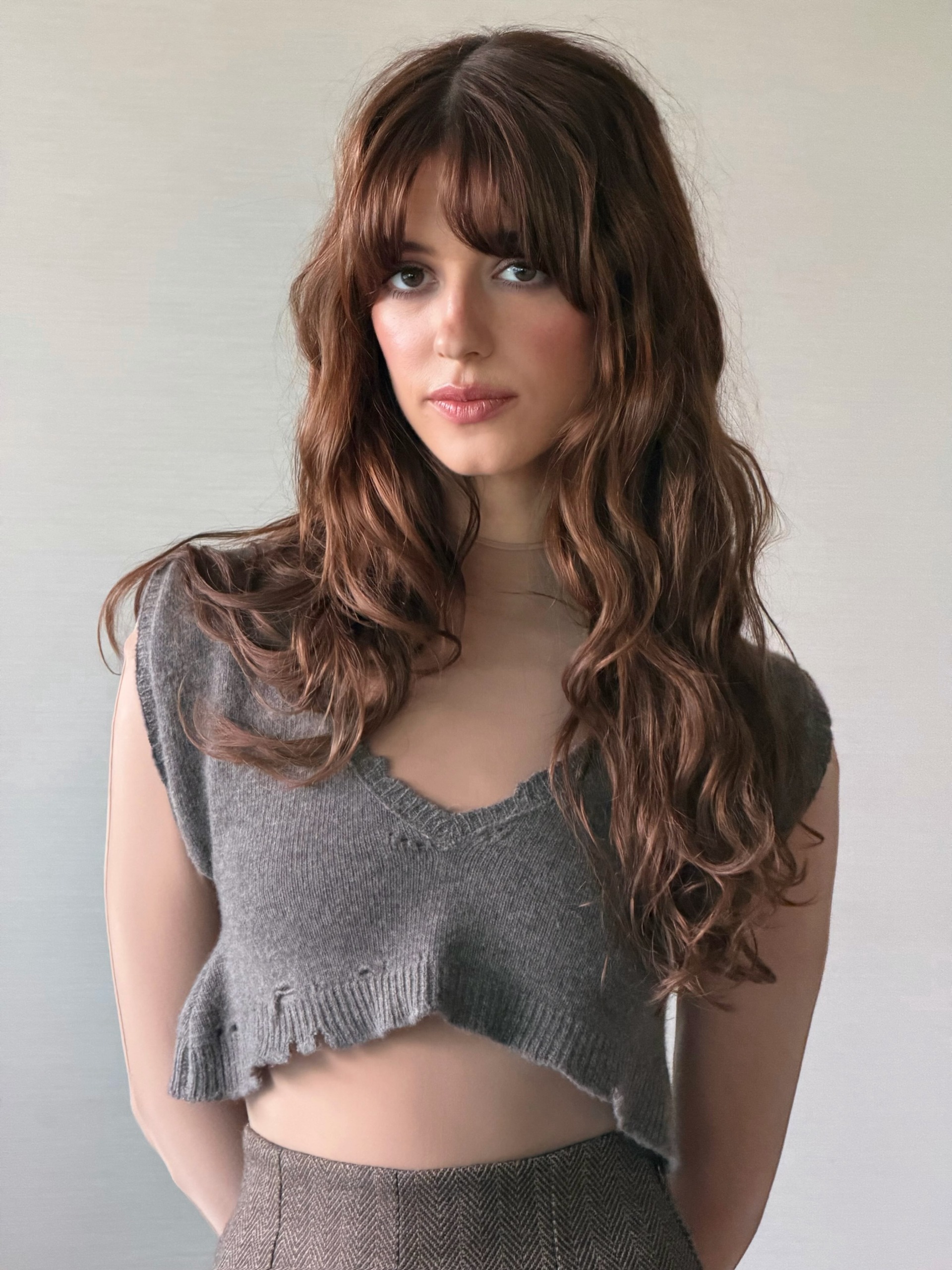 Daisy Edgar-Jones with dark wavy hair and auburn highlights