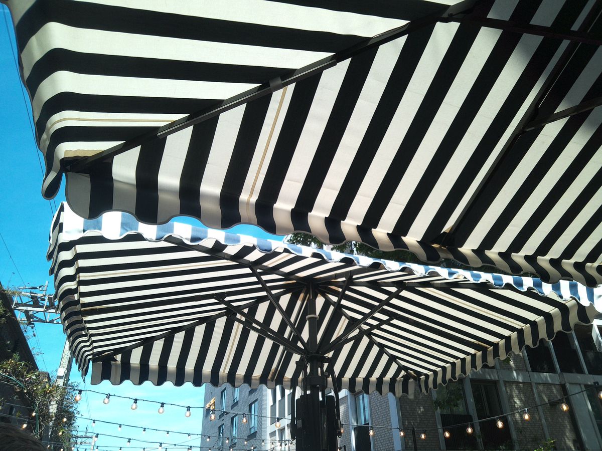 Sample image from Camp Snap CS-Pro digital compact camera showing close-up of striped umbrellas