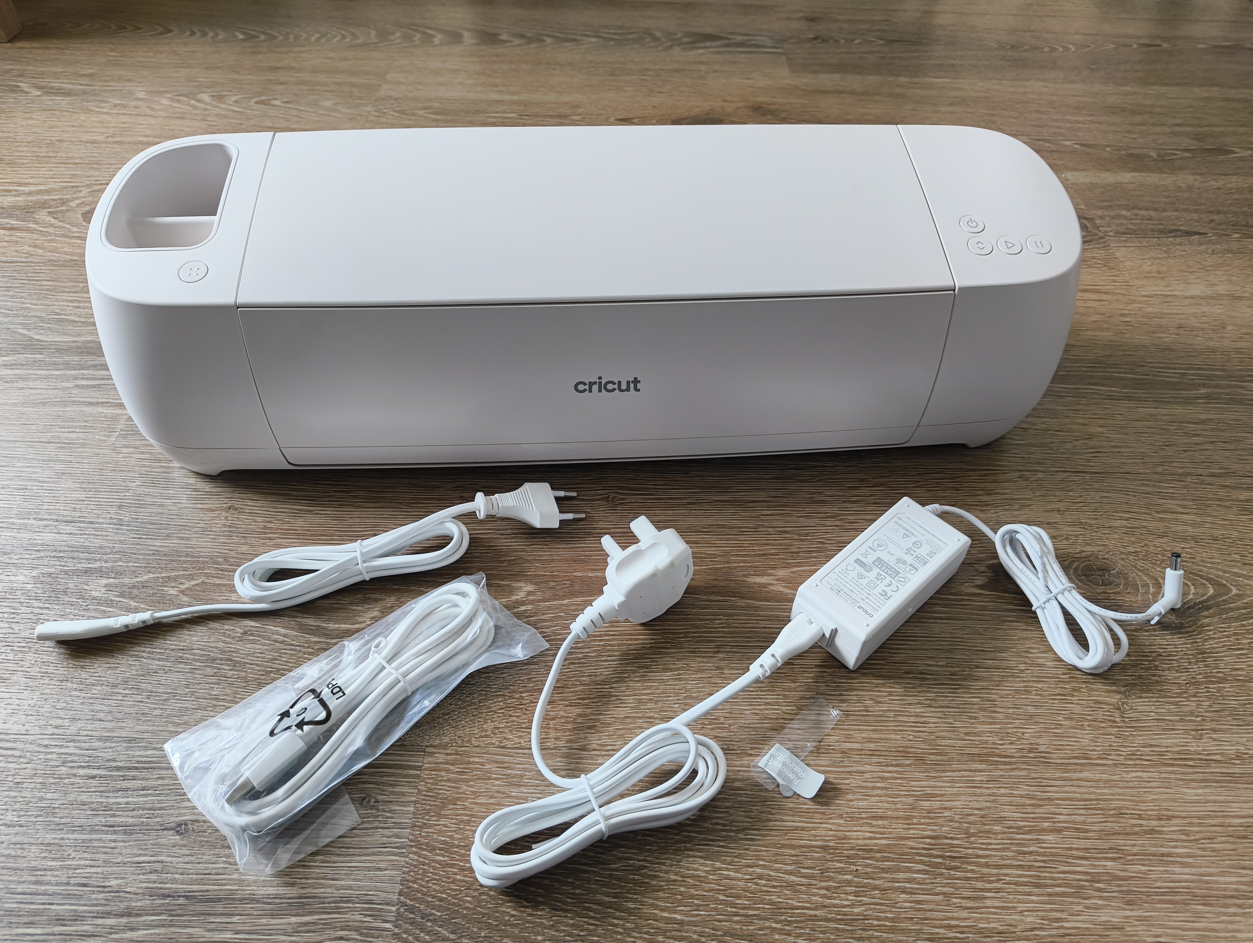 Cricut Explore 4 review: a white craft machine and accessories on a table