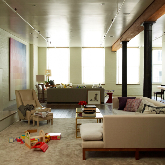 living room with L shaped sofa and armchair