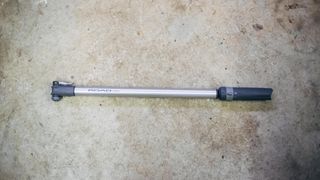 A grey and silver Topeak Road Masterblaster on a garage floor