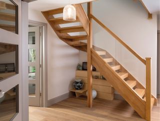 Solid oak staircase by StairBox in a modern hallway