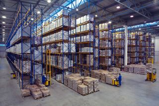 Inside warehouse with boxes stacked on racks