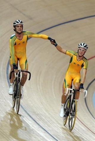 Australia's Micheal Freiberg (2nd) and Cameron Meyer (1st) celebrate their country's clean sweep in the scratch race.