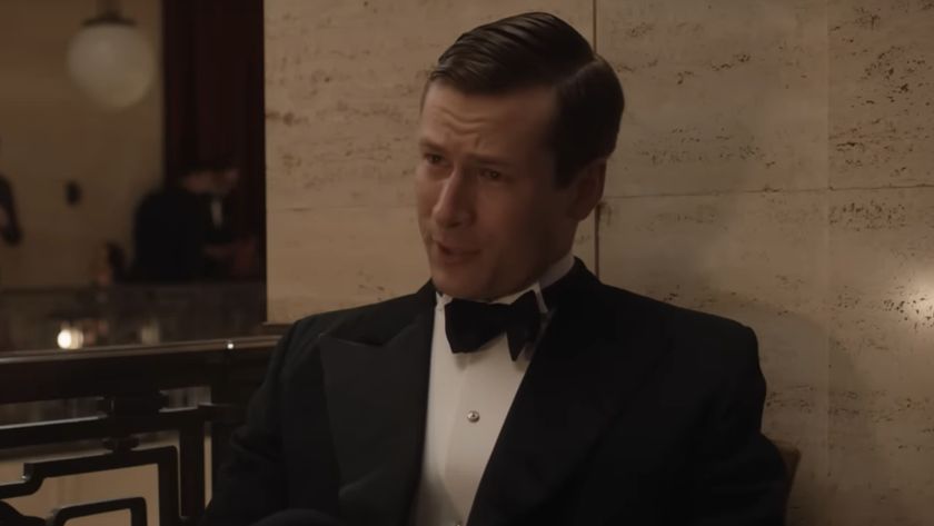 Glen Powell in a tux in The Guernsey Literary and Potato Peel Pie Society