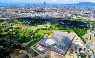 vast undulating roof shelters the generous public plaza