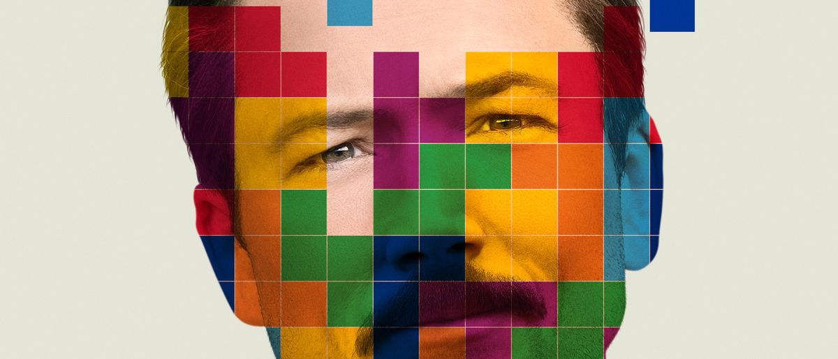 Taron Egerton as Henk Rogers, with colored blocks in front of him, in the Tetris poster.