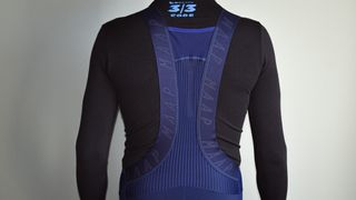 MAAP Apex winter bibtights in navy being worn with a black base layer