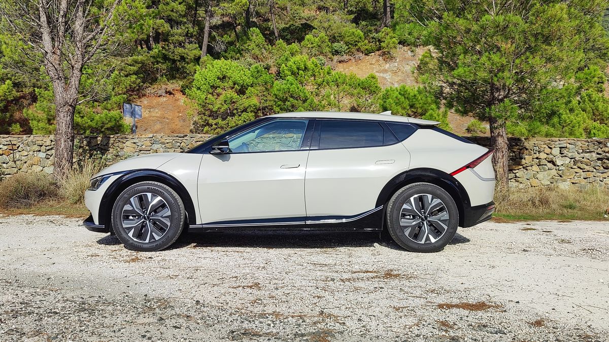 Side on view of Kia EV6 parked in a layby in the mountains