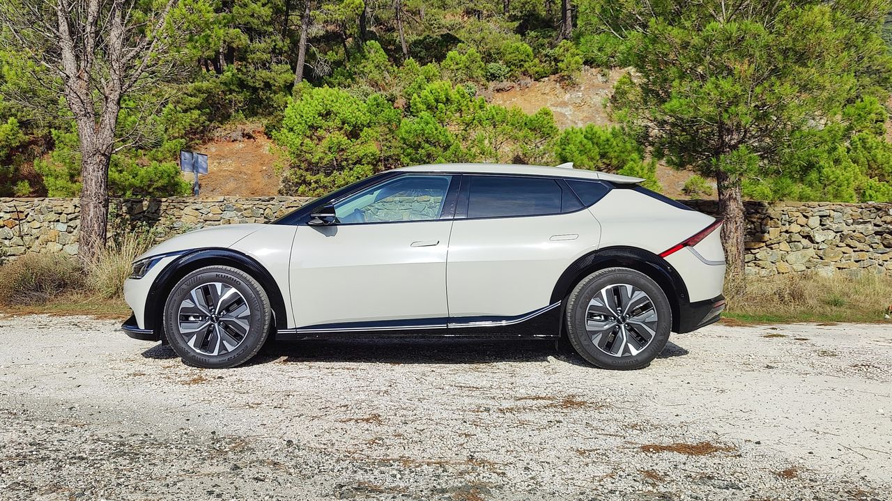 Side on view of Kia EV6 parked in a layby in the mountains