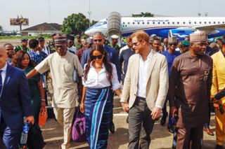 Meghan Markle holding hands with Prince Harry in Nigeria