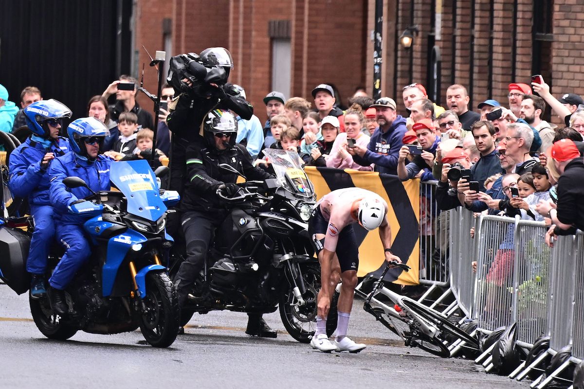Mathieu van der Poel (Netherlands) looks at his bike and shoe after crashing in the finishing laps