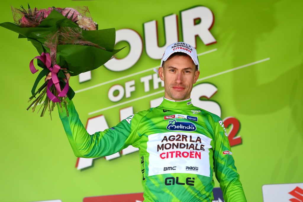 SAN MARTINO DI CASTROZZA ITALY APRIL 18 Geoffrey Bouchard of France and AG2R Citroen Team celebrates winning the green leader jersey on the podium ceremony after the 45th Tour of the Alps 2022 Stage 1 a 1609km stage from Cles to PrimieroS Martino di Castrozza 708m TouroftheAlps on April 18 2022 in San Martino di Castrozza Italy Photo by Tim de WaeleGetty Images