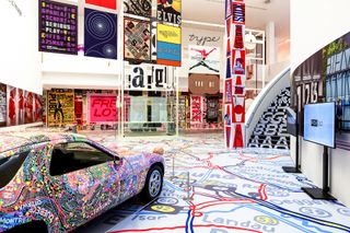 image of a decorated Porshe in a museum