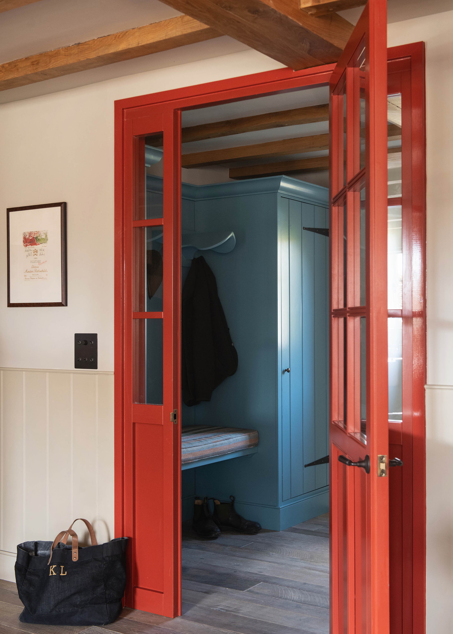 The farmhouse style interior of Monxton, with blues, reds, and natural wood finishes throughout.