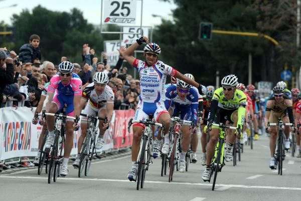 Loddo pumps his fist as he crosses the line