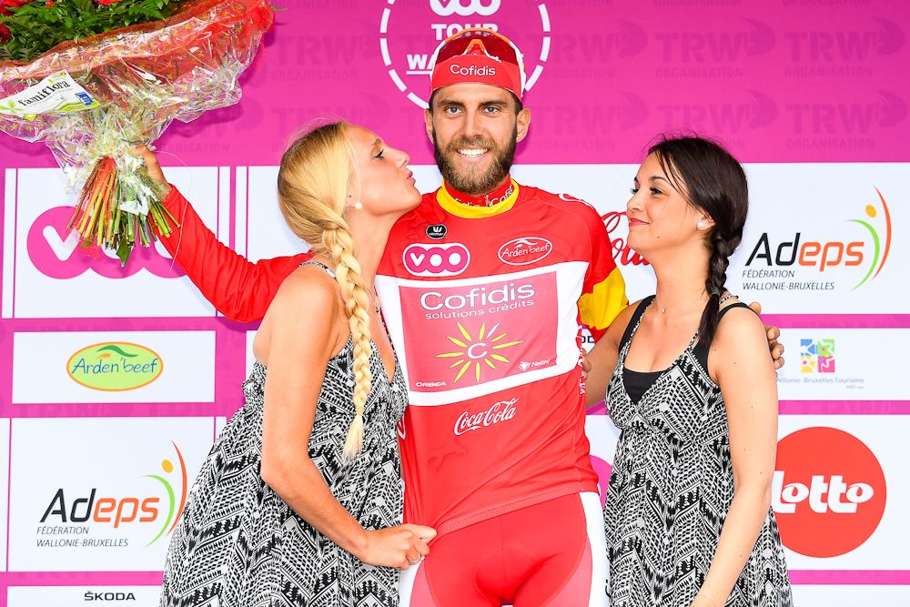 Loic Chetout celebrates on the podium with the best young's red jersey, after the first stage of the Tour De Wallonie