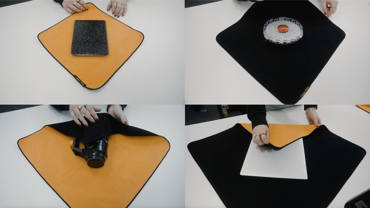 A sequence of four images showing different items—a tablet, a small container, a camera, and a laptop—being placed onto and then covered by two-toned, square, padded cloths (orange and black) designed to wrap and protect the objects.