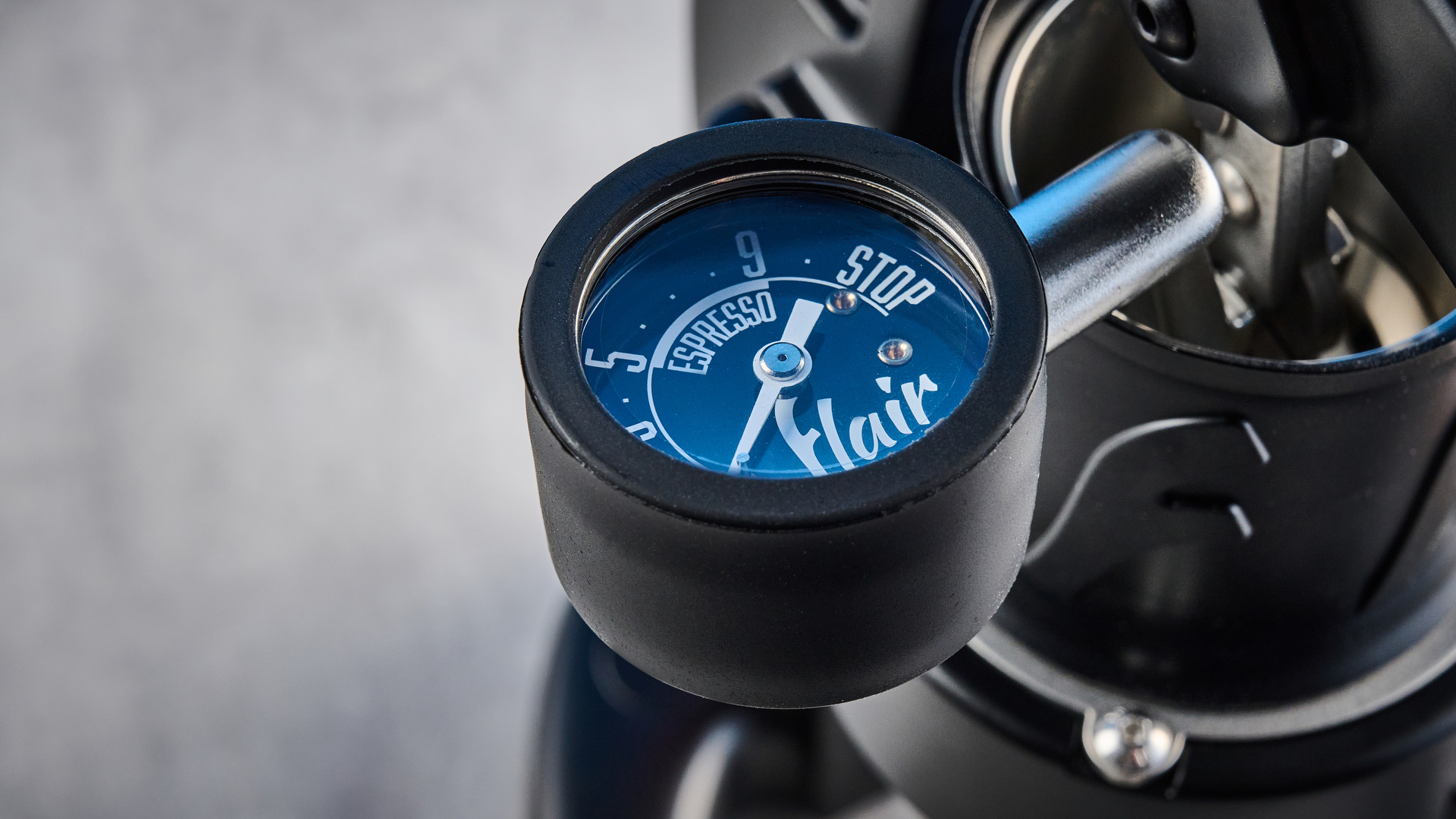 the flair 49 pro lever espresso machine photographed against the blue tom's guide background