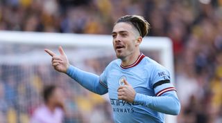 Jack Grealish of Manchester City celebrates after scoring a goal to make it 0-1 during the Premier League match between Wolverhampton Wanderers and Manchester City at Molineux on September 17, 2022 in Wolverhampton, United Kingdom.