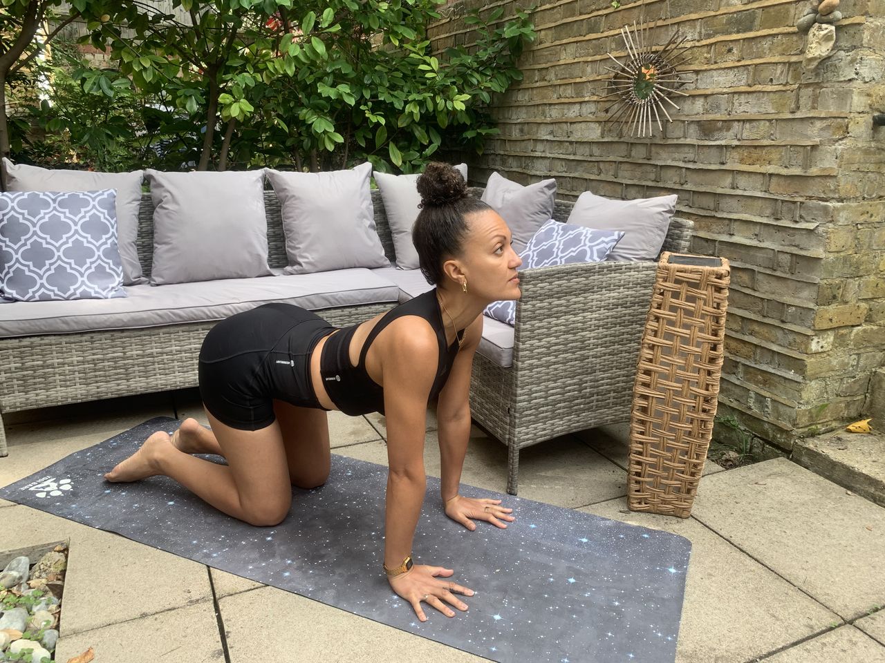 Yoga instructor Simone Venner demonstrates cat cow