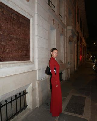 Influencer wearing a red maxi dress