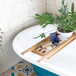 roll top bath with wooden bath board
